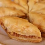 Closeup of Armenian baklava arranged on a round plate.