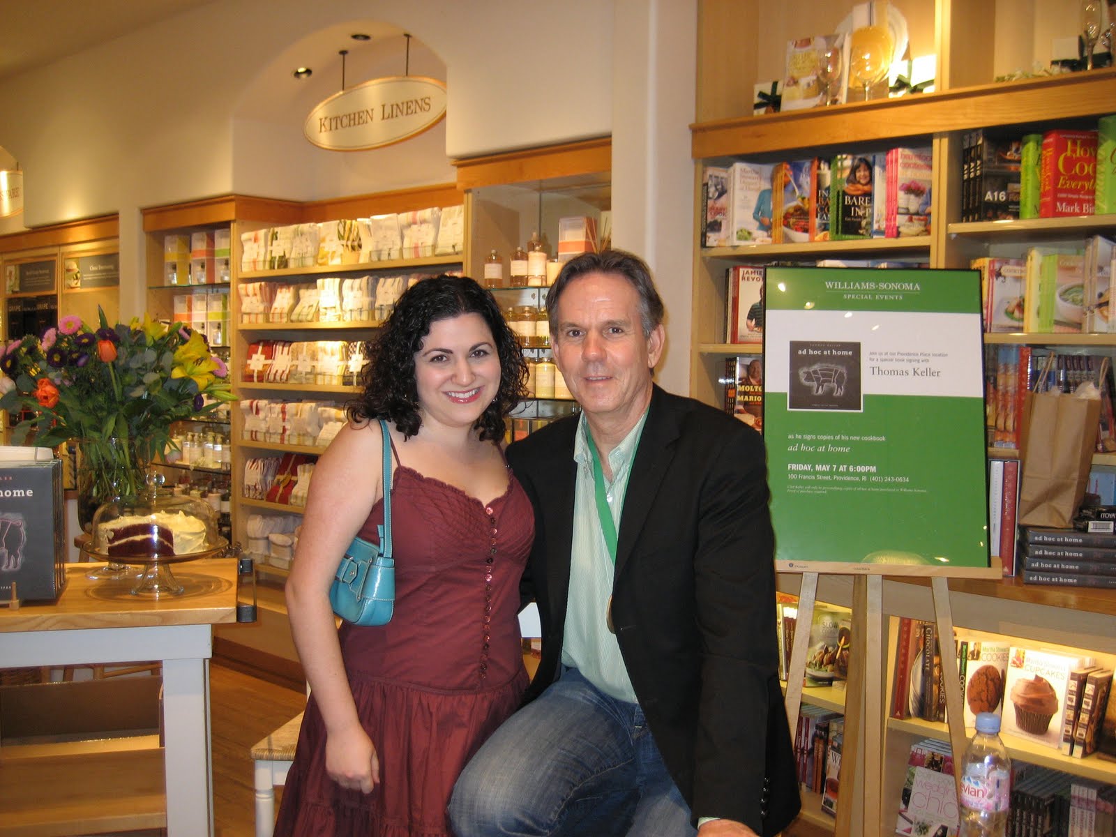 a woman posing with Thomas Keller