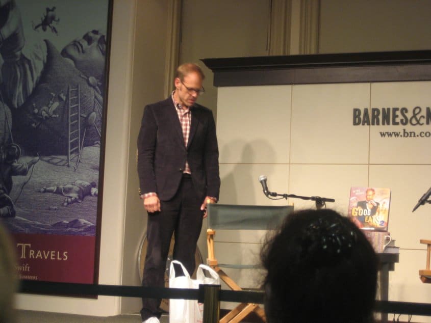 Alton Brown standing on a stage