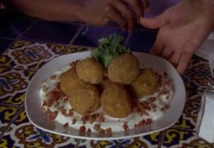 Screen shot from episode of Pyscho showing a plate of Fries Quatro Queso Dos Fritos.