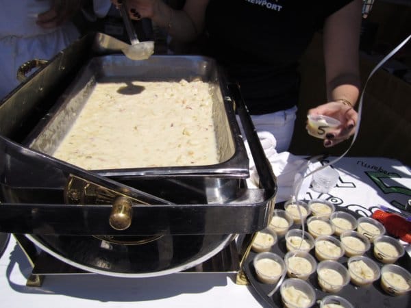 a large chafing dish of white clam chowder and a tray with small sample cups