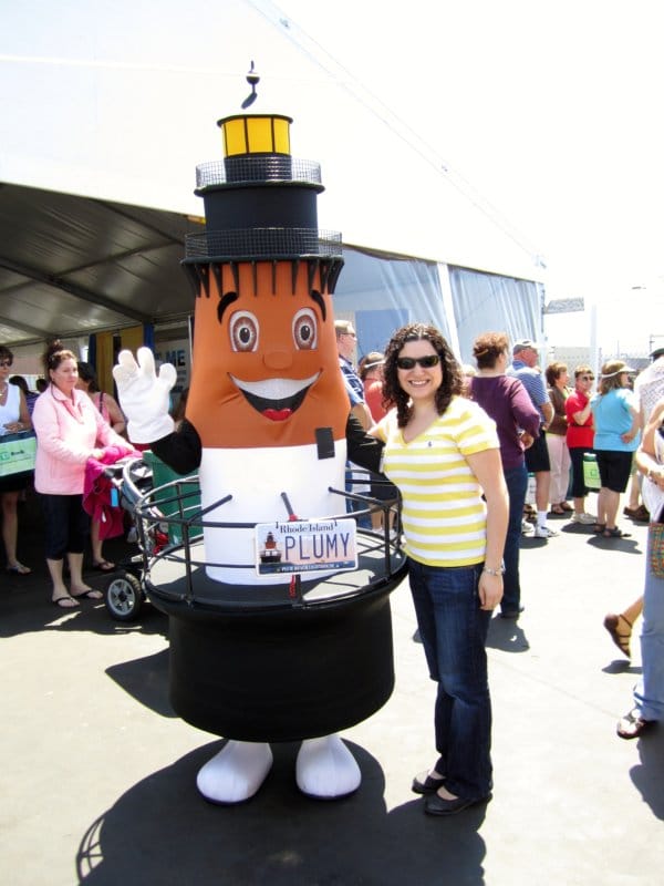 a woman posing with someone dressed up as a lighthouse