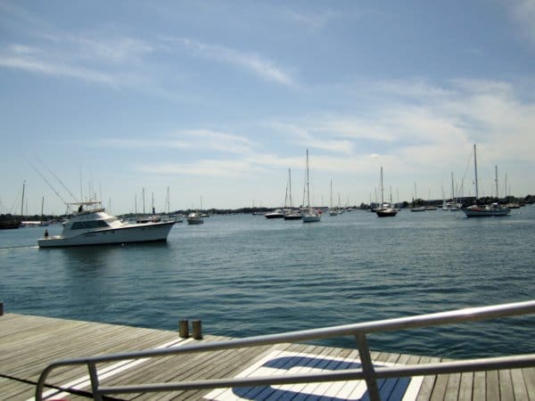 a view of boats in the water near a dock