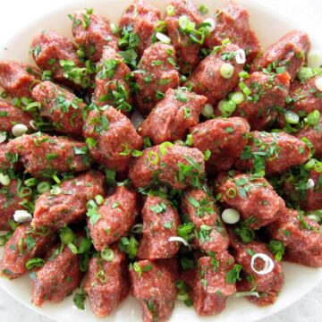 Chi kofte (Armenian steak tartare) arranged on a white oval platter.