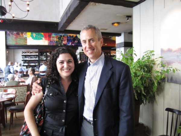 a woman posing with Danny Meyer in a restaurant