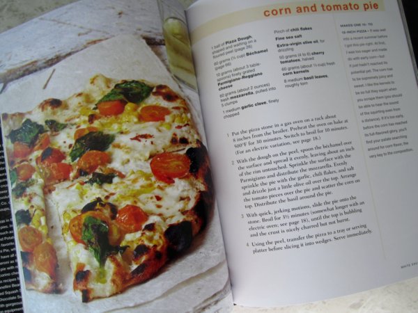 snapshot of a recipe and photo of a corn and tomato pizza in a cookbook