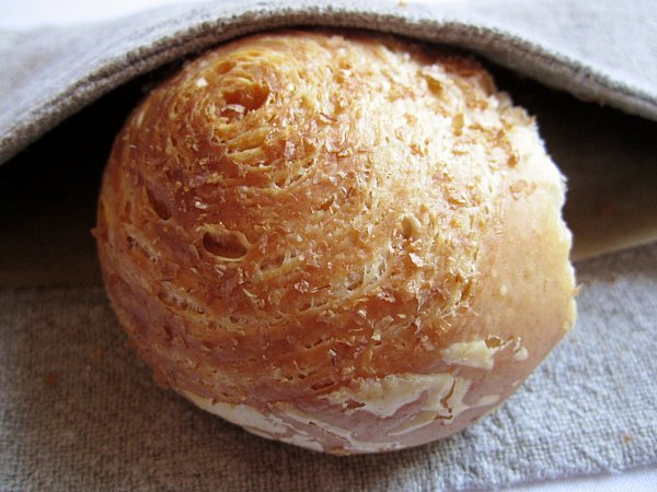 A close up of a small bread roll