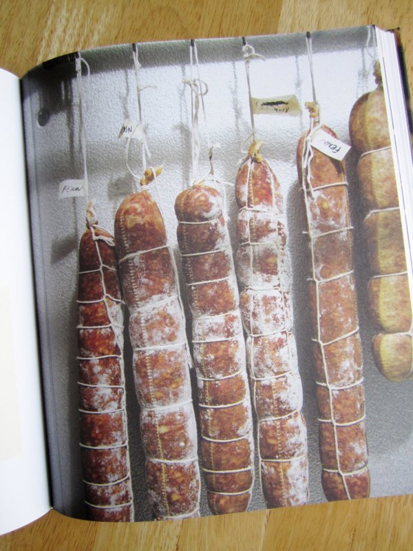 salamis hanging from strings
