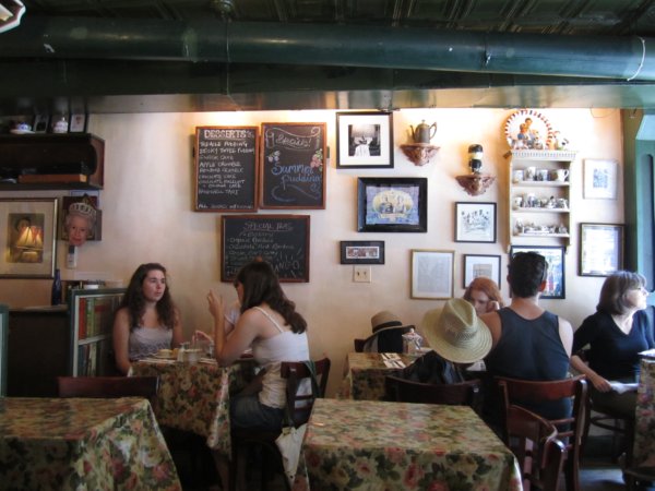 A group of people sitting in a small cozy restaurant