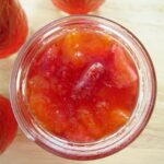 overhead view of a jar of strawberry peach preserves