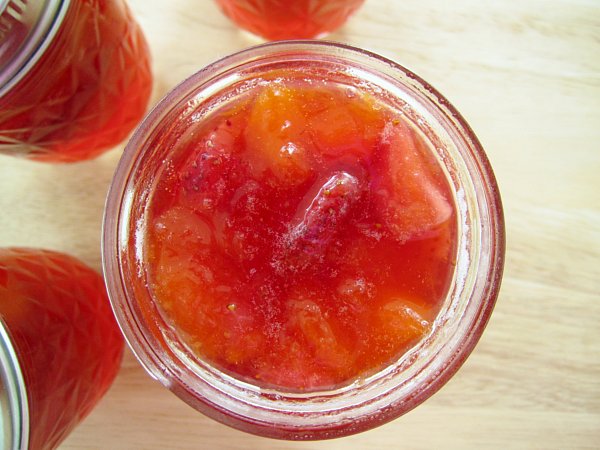 overhead view of a jar of strawberry peach preserves