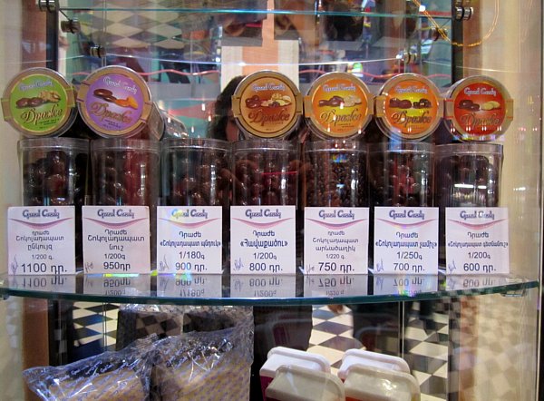 containers of chocolates on display in a store for sale