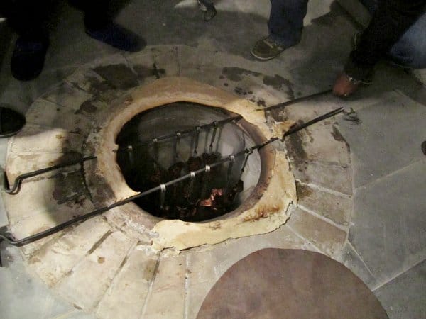 metal bars placed over an underground tonir oven