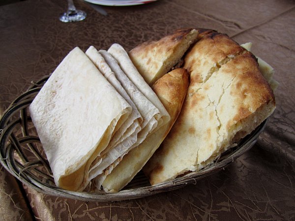 a bread basket with lavash and maknakash breads