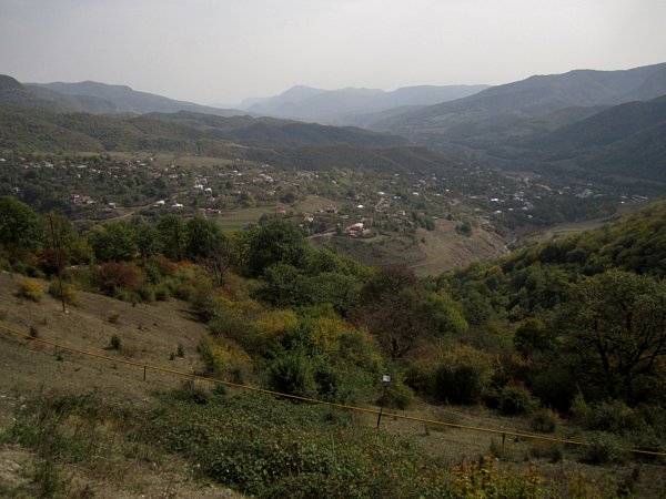 view of a small town looking down from a hilltop