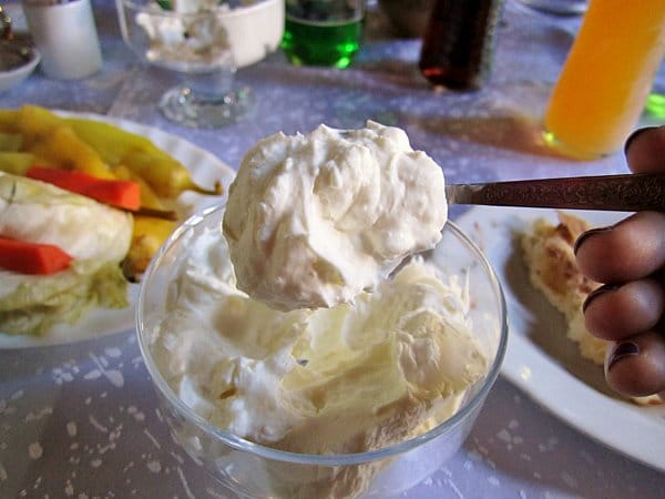 a closeup of a scoop of strained yogurt