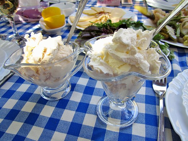 tall glass parfait containers filled with strained yogurt and thick sour cream