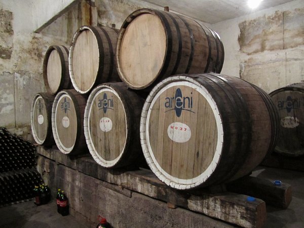 stacked wine barrels that say Areni on the side