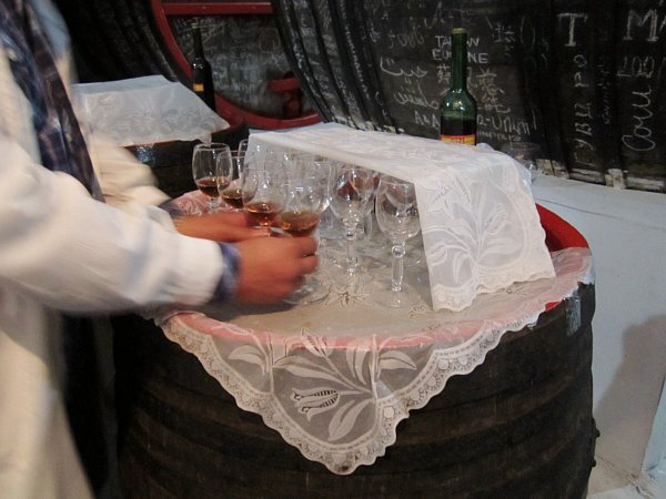 glasses of fortified wine on a white lace covered surface