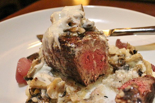 cross section of a filet mignon steak with a pinkish red center