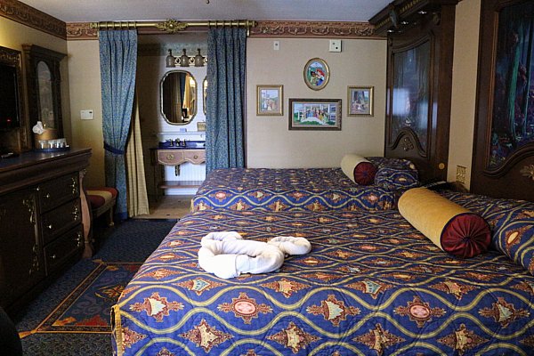A hotel room with two double beds