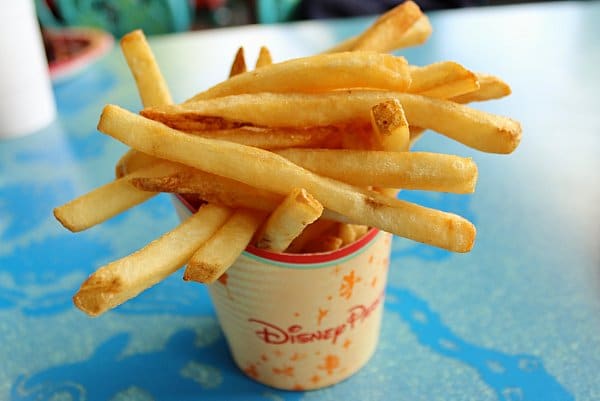 A cup of fries on a blue table