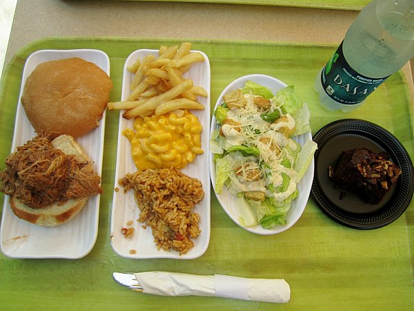 white plates with a variety of lunch foods on a light green tray