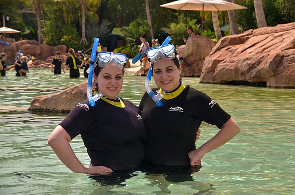 two women with snorkels posing in the water