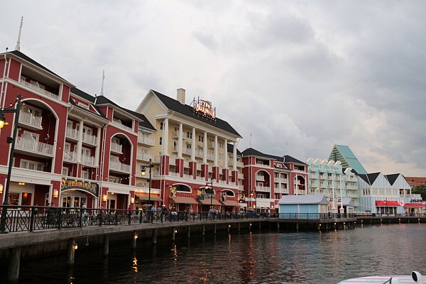 buildings lining a boardwalk along a body of water