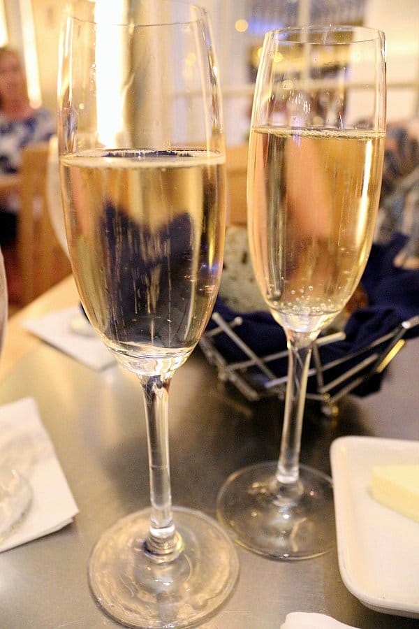 two glasses of sparkling wine on a table