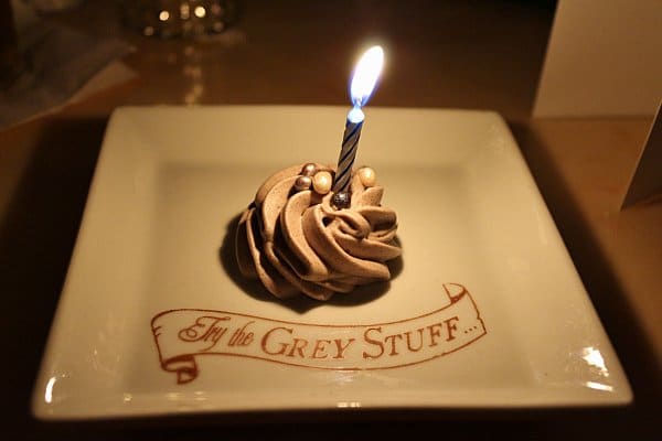 a rosette of mousse with a birthday candle in it