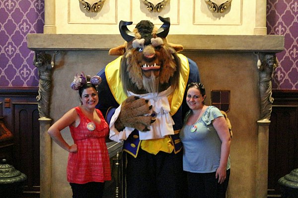 two women posing with the Beast from Beauty and the Beast