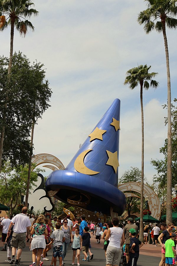 a giant blue cone shaped hat statue with a moon and stars on it