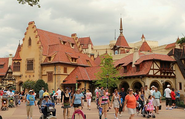 A group of people walking in front of a building