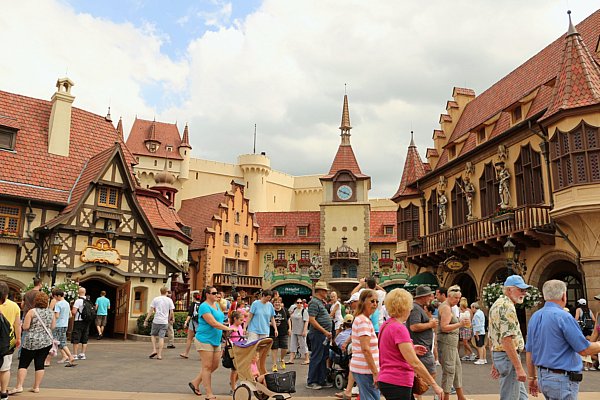 A group of people walking through the Germany Pavilion in Epcot