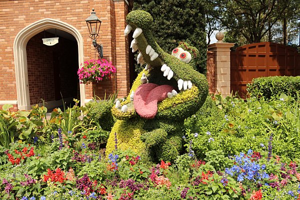 A closeup of a crocodile topiary in a garden