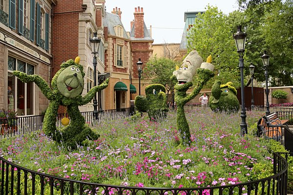 Beauty and the Beast themed topiaries in a French style garden