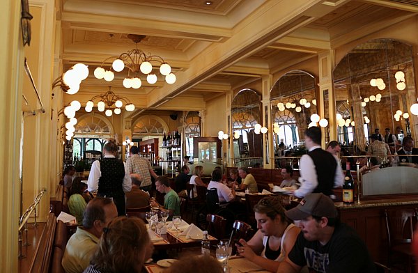 interior of a crowded restaurant with warm lights