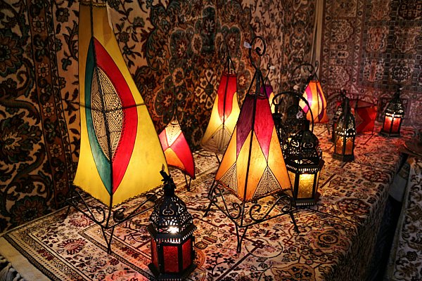 lanterns of different shapes and sizes on a table