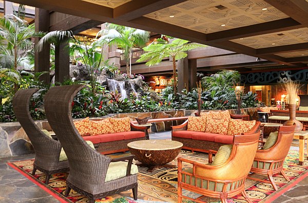 colorful sofas and chairs arranged around a round coffee table