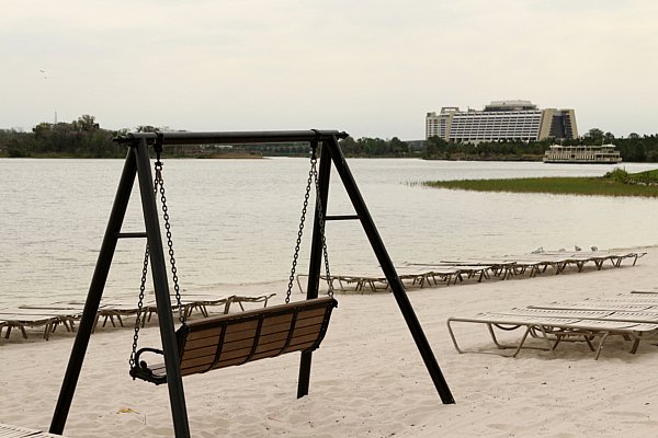 A wooden swing on a beach