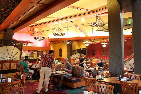 A group of people sitting inside a restaurant