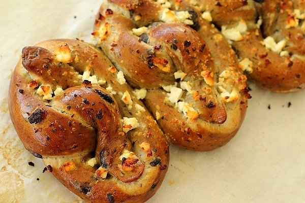 Olive and garlic soft pretzels with feta cheese