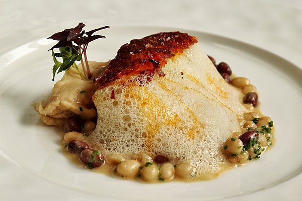 a plate of food with foam covered most of the dish