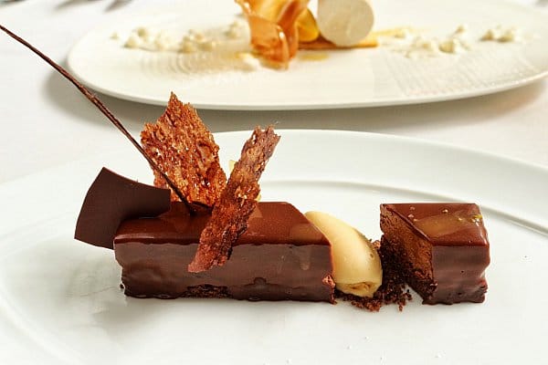 a closeup of a chocolate dessert on a white plate