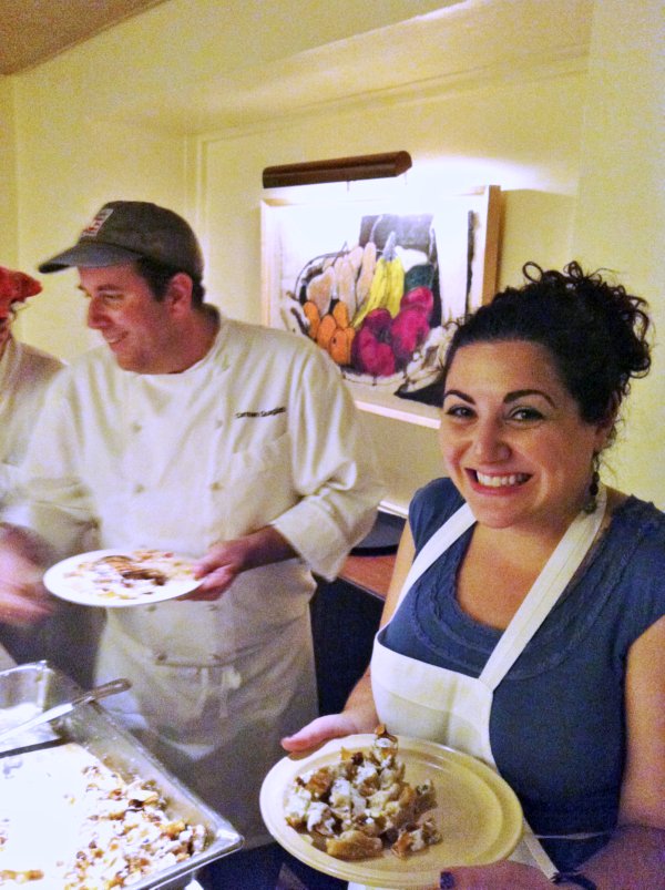 a man and a woman holding plates of food