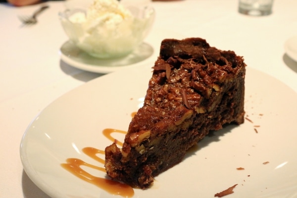 A slice of chocolate pie on a white plate