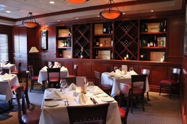 tables with white tablecloths and chairs in a restaurant dining room