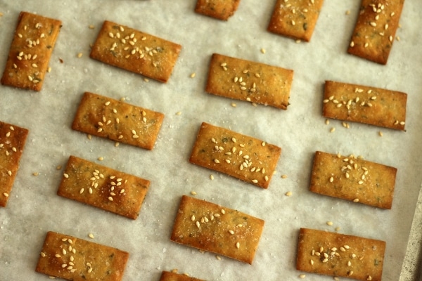 overhead view of small rectangular crackers on a white surface