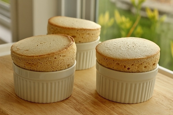 three souffles on a wooden board